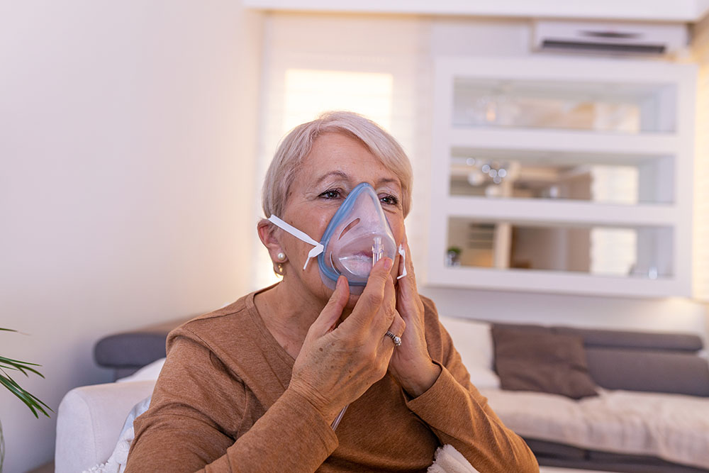 Sick Elderly Woman Breathing Oxygen